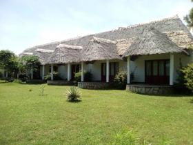 Old hotel built on wooded land