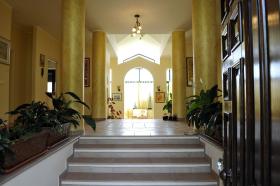 Three-story villa set in an olive grove