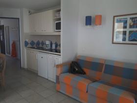 Sunny, ground floor apartment over looking small marina with small terrasse