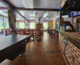 Fully fenced and secure building with pond